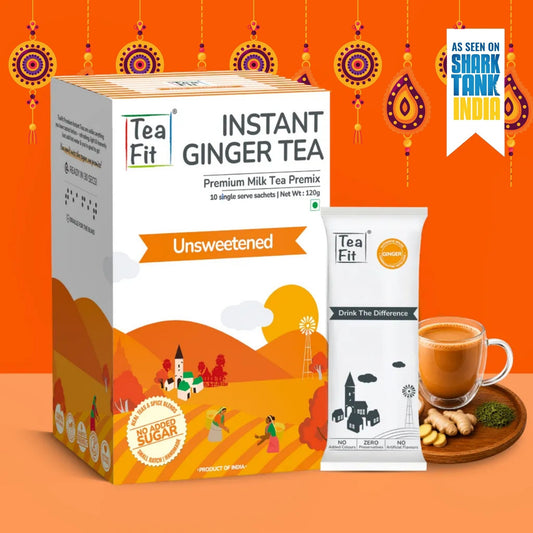 Tea Fit Instant Ginger Tea Premium Milk Tea Premix box and single-serve packet shown on an orange background with decorative hanging motifs, plus a glass of ginger tea, ginger root, and a Shark Tank India badge.