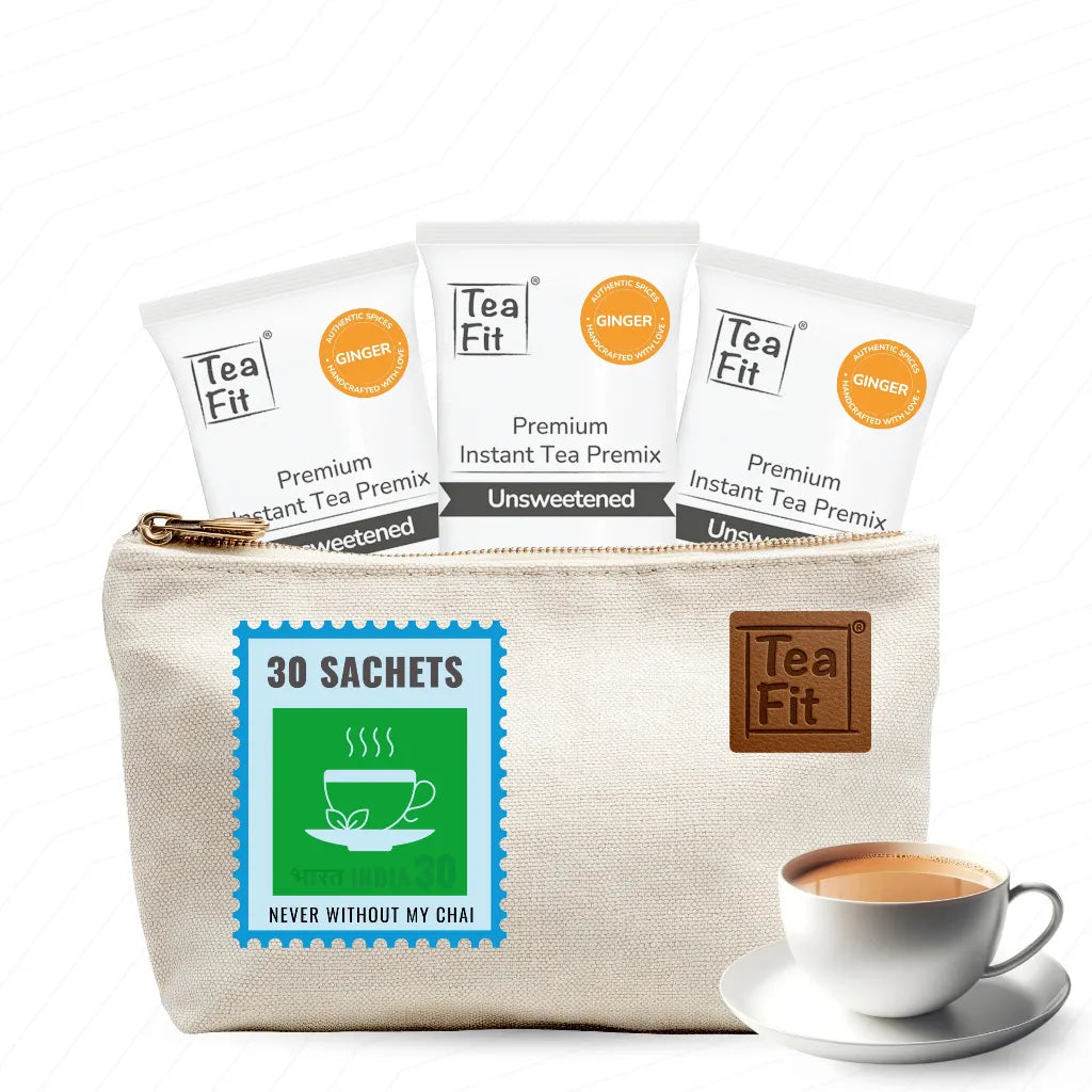 Tea Fit canvas travel pouch holding 30 Ginger-flavour sachets with a cup of chai beside it

