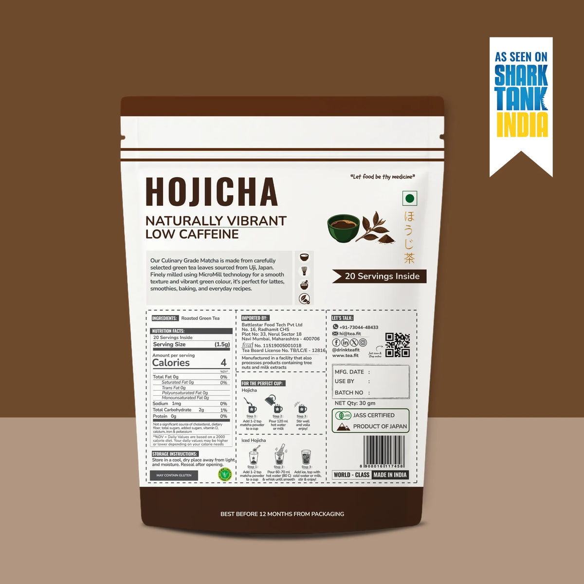 A stand-up pouch of 'Hojicha Naturally Vibrant Low Caffeine' tea by 'As Seen on Shark Tank India', shown against a solid brown background. The packaging is primarily white with dark brown borders at the top and bottom, featuring product details, nutritional facts, and a barcode on the lower half.