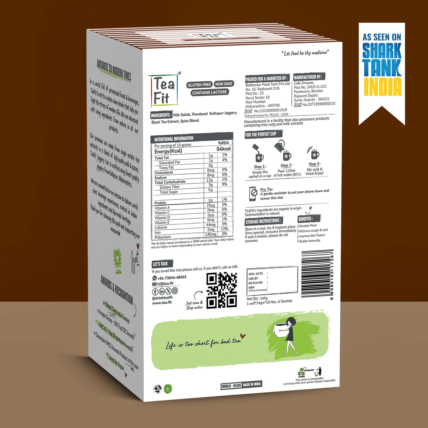 The back jaggery tea box package shown at an angle against a brown gradient background, featuring nutritional information, ingredients, and a green illustration at the bottom. A blue and yellow 'As seen on Shark Tank India' badge is in the top right corner.